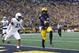 Michigan quarterback Shea Patterson (2) scores on a one-yard touchdown run as Penn State linebacker Micah Parsons (11) defends in the first half of an NCAA college football game in Ann Arbor, Mich., Saturday, Nov. 3, 2018. (AP Photo/Paul Sancya)