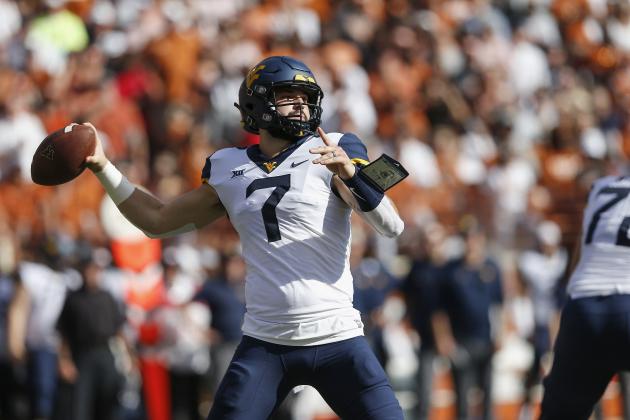 AUSTIN, TX - NOVEMBER 03:  Will Grier #7 of the West Virginia Mountaineers looks to pass in the first quarter against the Texas Longhorns at Darrell K Royal-Texas Memorial Stadium on November 3, 2018 in Austin, Texas.  (Photo by Tim Warner/Getty Images)
