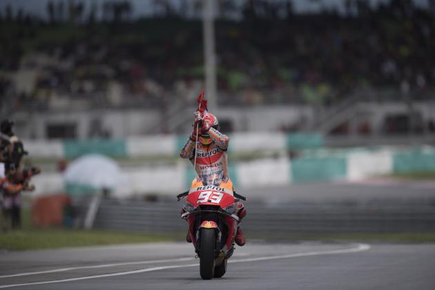 KUALA LUMPUR, MALAYSIA - NOVEMBER 04:  Marc Marquez of Spain and Repsol Honda Team celebrates the victory with flag at the end of the MotoGP race during the MotoGP Of Malaysia - Race at Sepang Circuit on November 4, 2018 in Kuala Lumpur, Malaysia.  (Photo by Mirco Lazzari gp/Getty Images)