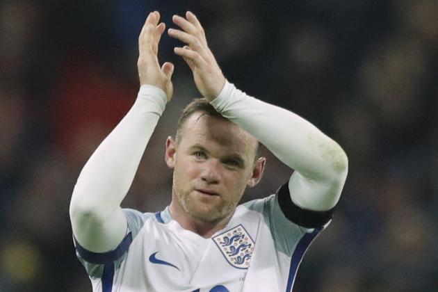 FILE - This is a Friday, Nov. 11, 2016  file photo of England's Wayne Rooney as he claps after winning the World Cup group F qualifying soccer match between England and Scotland with a 3-0 score at the Wembley stadium, London. England striker Wayne Rooney announced his immediate retirement from international football on Wednesday Aug. 23, 2017. (AP Photo/Matt Dunham/File)