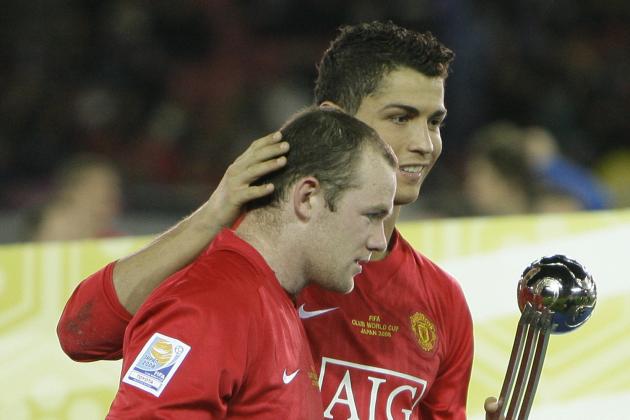 Cristiano Ronaldo, right, of England's Manchester United, hugs his teammate Wayne Rooney at the awarding ceremony after they defeated Ecuador's Liga Deportiva Universitaria Quito in the FIFA Club World Cup soccer tournament in Yokohama, Japan, Sunday, Dec. 21, 2008. Manchester United won the final 1-0. (AP Photo/David Guttenfelder)