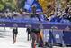 Lelisa Desisa takes his final strides before breaking the ribbon and winning the New York City Marathon.