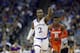 Kansas' Lagerald Vick (2) celebrates after hitting a 3-point basket as Clemson's Anthony Oliver II (21) watches during the first half of a regional semifinal game in the NCAA men's college basketball tournament Friday, March 23, 2018, in Omaha, Neb. (AP Photo/Charlie Neibergall)