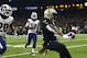 New Orleans Saints running back Alvin Kamara (41) scores on a touchdown carry ahead of Los Angeles Rams free safety Lamarcus Joyner (20) and inside linebacker Cory Littleton (58) in the first half of an NFL football game in New Orleans, Sunday, Nov. 4, 2018. (AP Photo/Butch Dill)