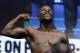 Floyd Mayweather Jr. poses on the scale during a weigh-in Friday, Aug. 25, 2017, in Las Vegas. Mayweather is scheduled to fight Conor McGregor in a boxing bout Saturday. (AP Photo/John Locher)