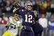 New England Patriots quarterback Tom Brady (12) passes under pressure from Green Bay Packers linebacker Kyler Fackrell (51) during the first half of an NFL football game, Sunday, Nov. 4, 2018, in Foxborough, Mass. (AP Photo/Charles Krupa)