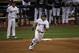 Milwaukee Brewers' Mike Moustakas (18) runs to second base after hitting an RBI double during the first inning of Game 6 of the National League Championship Series baseball game against the Los Angeles Dodgers Friday, Oct. 19, 2018, in Milwaukee. (AP Photo/Charlie Riedel)