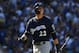 LOS ANGELES, CA - OCTOBER 17: Christian Yelich #22 of the Milwaukee Brewers reacts after striking out swinging during the third inning of Game Five of the National League Championship Series against the Los Angeles Dodgers at Dodger Stadium on October 17, 2018 in Los Angeles, California. (Photo by Harry How/Getty Images)