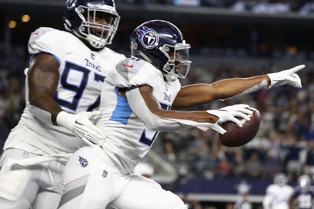 ARLINGTON, TX - NOVEMBER 05:  Darius Kilgo #97 and Kevin Byard #31 of the Tennessee Titans  celebrate the interception by Byard against the Dallas Cowboys in the first quarter of a football game at AT&T Stadium on November 5, 2018 in Arlington, Texas.  (Photo by Ronald Martinez/Getty Images)