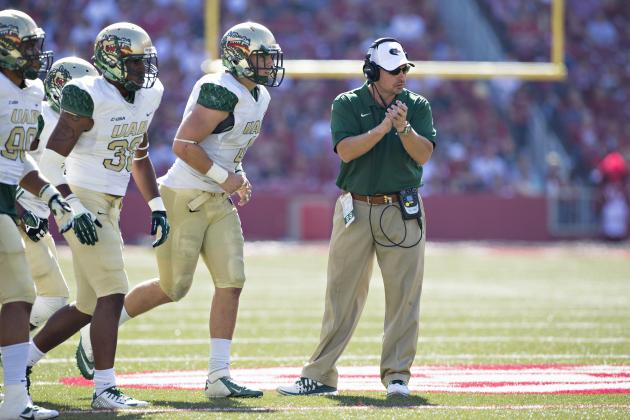 FAYETTEVILLE, AR - OCTOBER 25: Head Coach Bill Clark of the UAB Blazers claps for his team as the run onto the field during a game against the Arkansas Razorbacks at Razorback Stadium on October 25, 2014 in Fayetteville, Arkansas. The Razorbacks defeated the Blazers 45-17. (Photo by Wesley Hitt/Getty Images)
