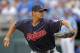 FILE - In this Sept. 30, 2018, file photo, Cleveland Indians pitcher Carlos Carrasco throws during the first inning of a baseball game against the Kansas City Royals, in Kansas City, Mo. The Indians have picked up their $9.75 million contract option on Carlos Carrasco for next season. (AP Photo/Charlie Riedel, File)