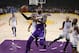 Los Angeles Lakers forward LeBron James, center, goes up for a shot as Minnesota Timberwolves guard Derrick Rose, left, forward Taj Gibson, second from right, and forward Andrew Wiggins watch during the first half of an NBA basketball game Wednesday, Nov. 7, 2018, in Los Angeles. (AP Photo/Mark J. Terrill)