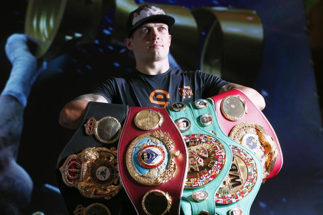 FILE - In this Wednesday, Aug. 1, 2018 file photo, Oleksandr Usyk presents his WBA, IBF, WBO and IBO belts trophies after a press conference in Kiev, Ukraine. Usyk is the undisputed Cruiserweight champion and picked up the first ever Muhammad Ali trophy in the World Boxing Super Series Final. The Ukrainian fighter makes the first defense of his four cruiserweight titles when he takes on Tony Bellew in Manchester on Saturday, Nov. 10, 2018. (AP Photo/Efrem Lukatsky, File)