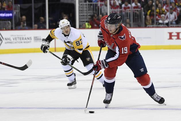 Washington Capitals center Nicklas Backstrom (19), of Sweden, skates with the puck in front of Pittsburgh Penguins center Sidney Crosby (87) during the first period of an NHL hockey game, Wednesday, Nov. 7, 2018, in Washington. (AP Photo/Nick Wass)