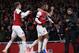 Arsenal's French striker Alexandre Lacazette (C) celebrates with teammates after scoring his team's first goal during the English Premier League football match between Arsenal and Liverpool at the Emirates Stadium in London on November 3, 2018. (Photo by Daniel LEAL-OLIVAS / AFP) / RESTRICTED TO EDITORIAL USE. No use with unauthorized audio, video, data, fixture lists, club/league logos or 'live' services. Online in-match use limited to 120 images. An additional 40 images may be used in extra time. No video emulation. Social media in-match use limited to 120 images. An additional 40 images may be used in extra time. No use in betting publications, games or single club/league/player publications. / (Photo credit should read DANIEL LEAL-OLIVAS/AFP/Getty Images)