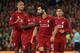 Liverpool's Egyptian midfielder Mohamed Salah (2nd R) celebrates with Liverpool's Senegalese striker Sadio Mane (2nd L) and Liverpool's Brazilian midfielder Fabinho (L) after scoring their third goal from the penalty spot during the UEFA Champions League group C football match between Liverpool and Red Star Belgrade at Anfield in Liverpool, north west England on October 24, 2018. (Photo by Oli SCARFF / AFP) (Photo credit should read OLI SCARFF/AFP/Getty Images)