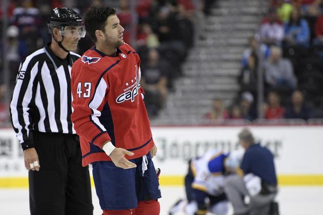 FILE - In this Sept. 30, 2018, file photo, Washington Capitals right wing Tom Wilson (43) is escorted by an official off the ice after he checked St. Louis Blues center Oskar Sundqvist, background, during the second period of an NHL preseason hockey game in Washington. Wilson has had his 20-game suspension reduced to 14 by a neutral arbitrator and is eligible to play immediately. Wilson has already served 16 games of his suspension for an illegal check to the head of St. Louis forward Oskar Sundqvist in each team’s preseason finale. The ruling by Shyam Das allows Wilson to return as soon as Tuesday night, Nov. 13, 2018, at Minnesota, and the 24-year-old will recoup $378,049 of the $1.26 million he initially forfeited as part of the suspension. (AP Photo/Nick Wass, File)