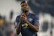 ManU midfielder Paul Pogba applauds fans at the end of the Champions League group H soccer match between Juventus and Manchester United at the Allianz stadium in Turin, Italy, Wednesday, Nov. 7, 2018. Manchester won 2-1. (AP Photo/Antonio Calanni)