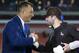 Cleveland Browns quarterback Baker Mayfield, right, shakes hands with former Cleveland Browns tackle Joe Thomas before being interviewed at the on-field set for Thursday Night Football after an NFL football game between the Cleveland Browns and the New York Jets , Thursday, Sept. 20, 2018, in Cleveland. (AP Photo/Ron Schwane)