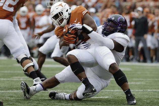 TCU defensive tackle Joseph Broadnax Jr. (54) pulls down Texas running back Daniel Young (32) during the first half of an NCAA college football game, Saturday, Sept. 22, 2018, in Austin, Texas. (AP Photo/Eric Gay)