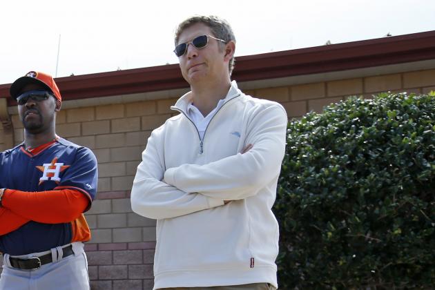 Quinton McCracken, left, director of player development for the Houston Astros, manager Bo Porter, and director of amateur scouting Mike Elias, stand during a spring training baseball workout, Tuesday, Feb. 25, 2014, in Viera, Fla. (AP Photo/Alex Brandon)