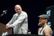 LAS VEGAS, NEVADA - OCTOBER 04: Dana White looks on as Conor McGregor of Ireland speaks during the UFC 229 Press Conference inside The Park Theater at Park MGM on October 4, 2018 in Las Vegas, Nevada. (Photo by Chris Unger/Zuffa LLC/Zuffa LLC via Getty Images)