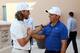 DUBAI, UNITED ARAB EMIRATES - NOVEMBER 18: Tommy Fleetwood of England (L) shakes hands with Francesco Molinari of Italy after Francesco Molinari wins the Race to Dubai during day four of the DP World Tour Championship at Jumeirah Golf Estates on November 18, 2018 in Dubai, United Arab Emirates. (Photo by Ross Kinnaird/Getty Images)