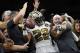 New Orleans Saints running back Mark Ingram (22) celebrates his touchdown with fans after jumping into the stands in the first half of an NFL football game against the Philadelphia Eagles in New Orleans, Sunday, Nov. 18, 2018. (AP Photo/Bill Feig)