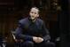 Former NFL football quarterback Colin Kaepernick is seated on stage during W.E.B. Du Bois Medal ceremonies, Thursday, Oct. 11, 2018, at Harvard University, in Cambridge, Mass. Kaepernick is among eight recipients of Harvard University's W.E.B. Du Bois Medals in 2018. Harvard has awarded the medal since 2000 to people whose work has contributed to African and African-American culture. (AP Photo/Steven Senne)