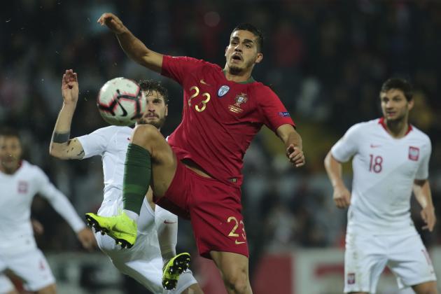 Portugal's Andre Silva vies for the ball with Poland's Mateusz Klich, center left, during the UEFA Nations League soccer match between Portugal and Poland at the D. Afonso Henriques stadium in Guimaraes, Portugal, Tuesday, Nov. 20, 2018. (AP Photo/Manuel Araujo)