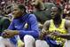 Golden State Warriors' Kevin Durant, left, and Draymond Green sit on the bench during the first half of an NBA basketball game against the Houston Rockets Thursday, Nov. 15, 2018, in Houston. (AP Photo/David J. Phillip)