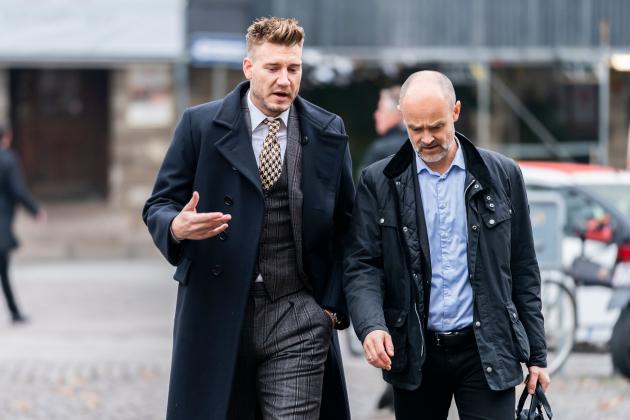 Rosenborg's Danish football player Nicklas Bendtner and lawyer Anders Nemeth arrive for a hearing at Copenhagen City Council on November 2, 2018. - Nicklas Bendtner has been charged with violence against a taxi driver in Copenhagen while the driver has been charged with attempted violence. (Photo by Martin Sylvest / Ritzau Scanpix / AFP) / Denmark OUT (Photo credit should read MARTIN SYLVEST/AFP/Getty Images)