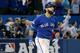 TORONTO, ON - OCTOBER 14: Jose Bautista #19 of the Toronto Blue Jays watches after he he hits a three-run home run in the seventh inning against the Texas Rangers in game five of the American League Division Series at Rogers Centre on October 14, 2015 in Toronto, Canada. (Photo by Tom Szczerbowski/Getty Images)