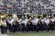 Members Washington Huskies band stand on the field during a moment of silence in tribute to Microsoft founder and philanthropist Paul Allen, who died Monday, Oct. 15, 2018, before an NCAA college football game between Washington and Colorado, Saturday, Oct. 20, 2018, in Seattle. (AP Photo/Ted S. Warren)