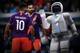 CORRECTS NAME TO JAN HENDRIK BERLIN - Jan Hendrik Berlin of the Nao Devils team repair robots prior a soccer match of the Standard Platform Liga competition at the RoboCup German Open 2018 in Magdeburg, Germany, Saturday, April 28, 2018. Around 200 teams with more than 1,000 participants from 16 countries demonstrate the state-of-the-art in robotics with competitions such as in soccer, rescue and service robots until Sunday, April 29, 2018. (AP Photo/Jens Meyer)