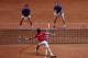 Mate Pavic of Croatia, bottom, returns the ball to France's Nicolas Mahut, right, and Pierre Hughes Herbert during the Davis Cup final between France and Croatia, Saturday, Nov. 24, 2018 in Lille, northern France. Croatia is within one point of a second Davis Cup title after Borna Coric and Marin Cilic dispatched their French rivals in the opening singles matches of the final to take a 2-0 lead. (AP Photo/Thibault Camus)