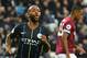 Manchester City's English midfielder Raheem Sterling (L) celebrates scoring their second goal during the English Premier League football match between West Ham United and Manchester City at The London Stadium, in east London on November 24, 2018. (Photo by Glyn KIRK / AFP) / RESTRICTED TO EDITORIAL USE. No use with unauthorized audio, video, data, fixture lists, club/league logos or 'live' services. Online in-match use limited to 120 images. An additional 40 images may be used in extra time. No video emulation. Social media in-match use limited to 120 images. An additional 40 images may be used in extra time. No use in betting publications, games or single club/league/player publications. / (Photo credit should read GLYN KIRK/AFP/Getty Images)