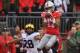 COLUMBUS, OH - NOVEMBER 24: Chris Olave #17 of the Ohio State Buckeyes catches a 24-yard touchdown pass in the second quarter in front of Brandon Watson #28 of the Michigan Wolverines at Ohio Stadium on November 24, 2018 in Columbus, Ohio. (Photo by Jamie Sabau/Getty Images)