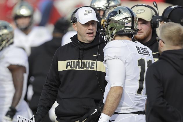 Purdue head coach Jeff Brohm talks quarterback David Blough (11) during the second half of an NCAA college football game against Indiana, Saturday, Nov. 24, 2018, in Bloomington, Ind. Purdue won 28-21. (AP Photo/Darron Cummings)