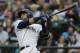 Seattle Mariners Nelson Cruz watches his two-run home run during the first inning of the team's baseball game against the Toronto Blue Jays, Thursday, Aug. 2, 2018, in Seattle. (AP Photo/Ted S. Warren)