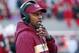 FILE- In this Nov. 3, 2018, file photo Florida State head coach Willie Taggart confers on his headset during the first half of an NCAA college football game against North Carolina State in Raleigh, N.C. The Seminoles have a chance to salvage their season against No. 13 Florida (8-3, No. 11 CFP) in Tallahassee on Saturday, Nov. 24. (AP Photo/Chris Seward, File)