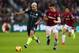 LONDON, ENGLAND - NOVEMBER 24: Sergio Aguero of Manchester City runs with the ball past Declan Rice of West Ham United during the Premier League match between West Ham United and Manchester City at London Stadium on November 24, 2018 in London, United Kingdom. (Photo by Catherine Ivill/Getty Images)