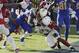 Los Angeles Chargers running back Melvin Gordon, left, runs into the end zone for a touchdown as Arizona Cardinals outside linebacker Haason Reddick, right, attempts a tackle during the first half of an NFL football game Sunday, Nov. 25, 2018, in Carson, Calif. (AP Photo/Jae C. Hong )