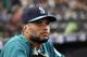 Seattle Mariners second baseman Robinson Cano looks on from the dugout before a baseball game against the Texas Rangers Friday, Sept. 28, 2018, in Seattle. (AP Photo/Elaine Thompson)