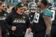 Jacksonville Jaguars offensive coordinator Nathaniel Hackett celebrates with Jaguars defensive tackle Marcell Dareus (99) during the second half of an NFL wild-card playoff football game against the Buffalo Bills, Sunday, Jan. 7, 2018, in Jacksonville, Fla. Jaguars beat the Bills 10-3. (AP Photo/Stephen B. Morton)