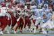 North Carolina State, left, and North Carolina players scuffle following the game-winning touchdown by North Carolina State's Reggie Gallaspy II (25) in overtime of an NCAA college football game in Chapel Hill, N.C., Saturday, Nov. 24, 2018. North Carolina State won 43-28. (AP Photo/Gerry Broome)