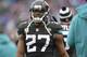 Jacksonville Jaguars running back Leonard Fournette looks on from the bench during the second half of an NFL football game against the Buffalo Bills, Sunday, Nov. 25, 2018, in Orchard Park, N.Y. (AP Photo/Adrian Kraus)