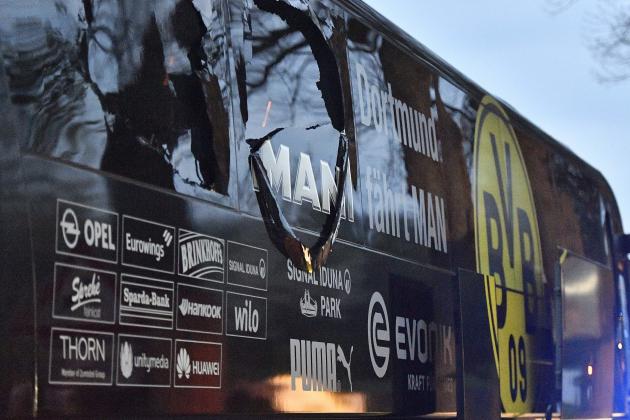 FILE - In this April 11, 2017 file photo a window of Dortmund's team bus is damaged after an explosion before the Champions League quarterfinal soccer match between Borussia Dortmund and AS Monaco in Dortmund, Germany. On Thursday, Dec. 21, 2017 a man will go on trial. He is charged with the attempted murder of Borussia's soccer team by detonating homemade bombs when traveling to the match.  (AP Photo/Martin Meissner,file)