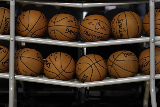 FILE - In this Dec. 6, 2017, file photo, basketballs sit in a rack on the court during a training session by the Brooklyn Nets at the Mexico City Arena in Mexico City. The four major pro sports leagues and the NCAA think that expanding legal betting will lead to more game-fixing. The architects of New Jersey’s successful legal challenge to the sports gambling ban say those fears are overstated and that bringing sports betting out of the shadows will make it easier to detect illegal activity. (AP Photo/Rebecca Blackwell, File)