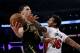 Los Angeles Lakers guard Lonzo Ball, left, goes to the basket while defended by Miami Heat forward James Johnson during the second half of an NBA basketball game Friday, March 16, 2018, in Los Angeles. The Heat won 92-91. (AP Photo/Ringo H.W. Chiu)